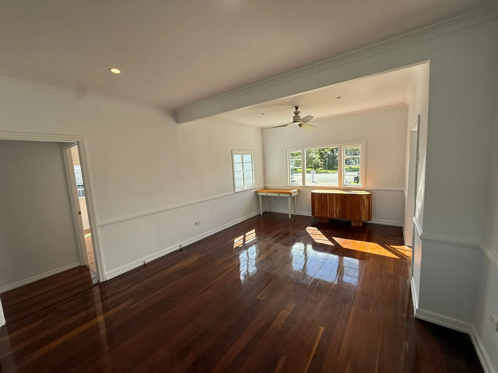 Freshly painted empty living room with polished timber floors