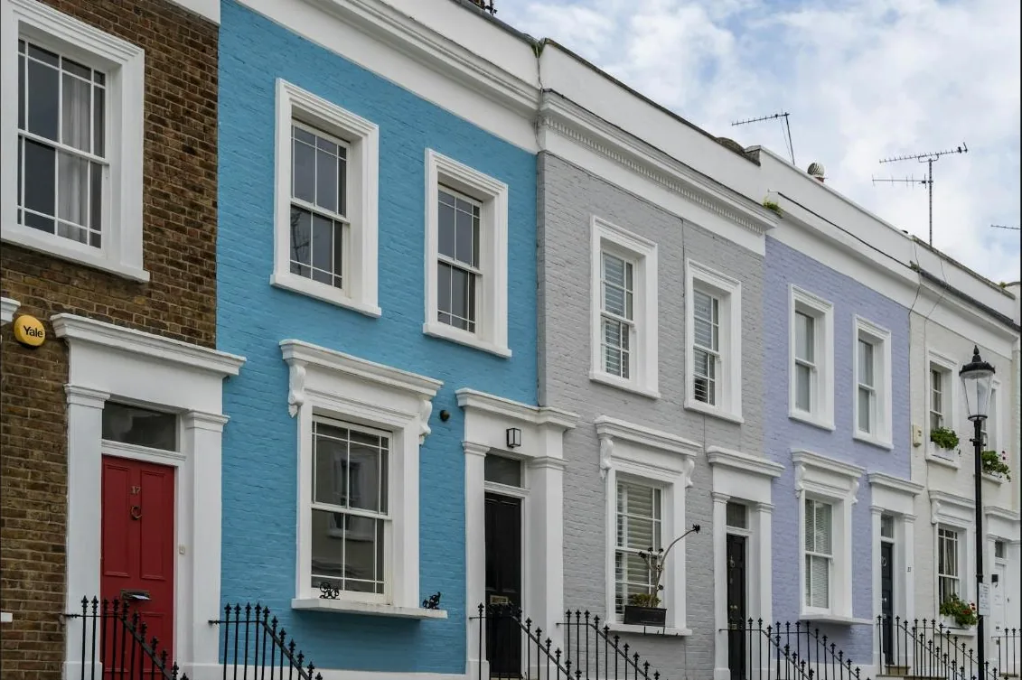 Row of painted house exteriors in good condition